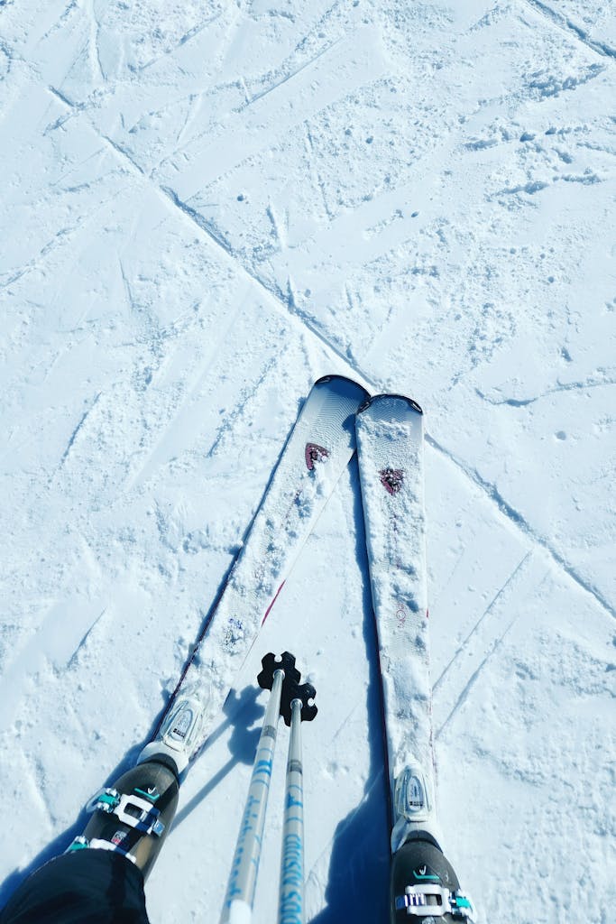 Close-up of ski tips on snowy ground, capturing winter sports in Granby, Colorado.